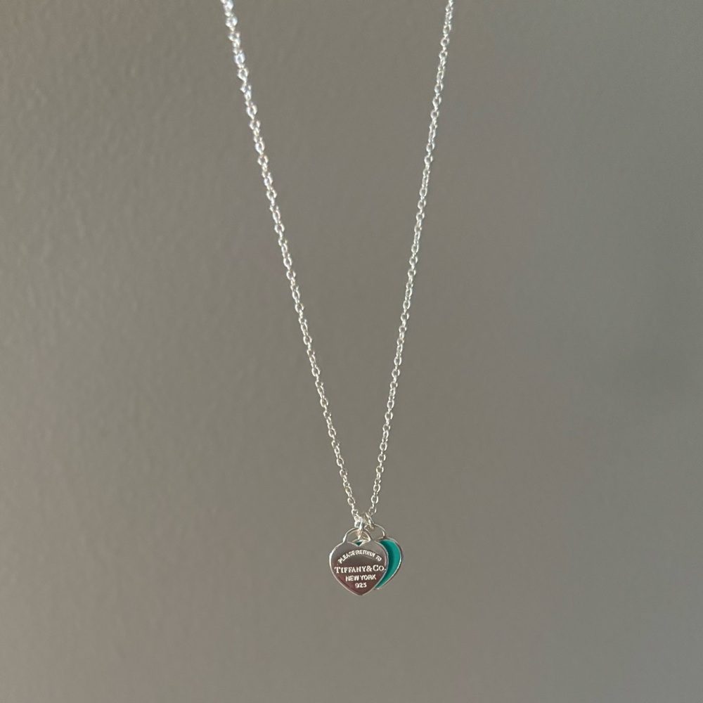 Tiffany and co mini double heart tag pendant
in silver